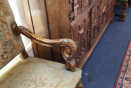 A pair of 19th century French Restauration style parcel gilt and carved beech armchairs, W.2ft 5in. D.2ft 3in. H.4ft 1in.